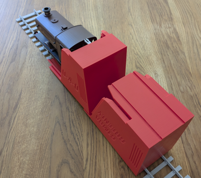Image of the 3D printed Greenly Locomotive storage box showing the locomotive driving out onto the rails